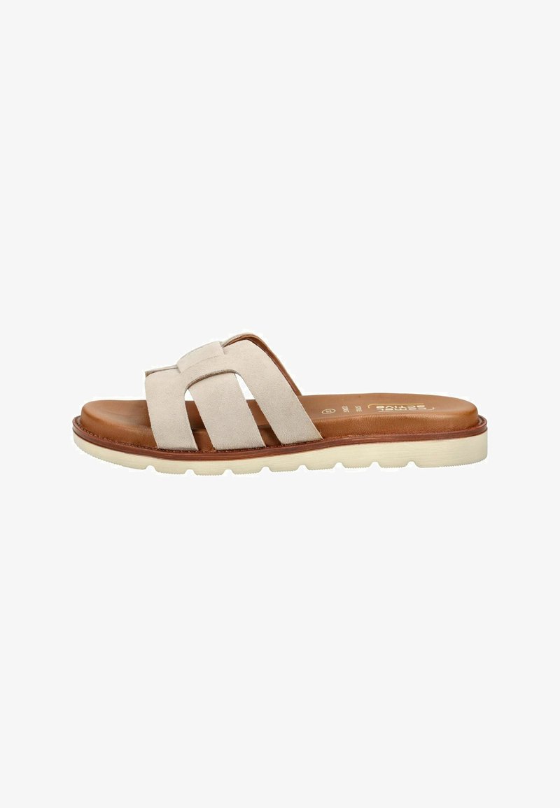 Sandale slip-on en daim beige avec trois larges brides, semelle intérieure marron rembourrée et semelle extérieure en caoutchouc blanc rainurée.