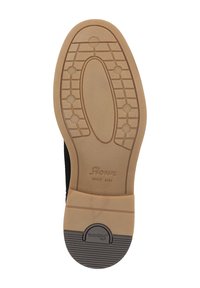 Suola di scarpa nera con una base in gomma leggera di colore beige chiaro. Presenta un motivo a griglia per la trazione e un marchio in rilievo nella zona del tallone.