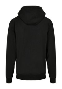 Svart hoodie med kengurufickor, ribbstickade ärmslut och nederkant. Har en avslappnad passform och en justerbar huva. Slät textur, minimalistisk design.