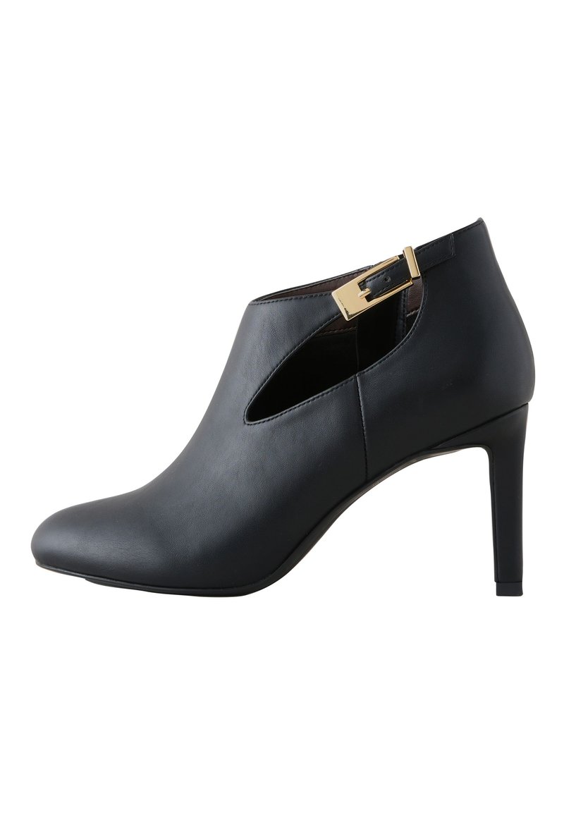 Black leather ankle boots with a pointed toe, open side cutouts, and a gold buckle accent on the ankle strap. Stiletto heel design.
