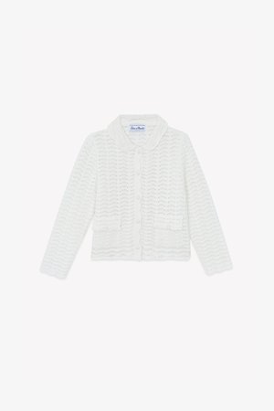 White knitted cardigan with a scalloped collar, button front, and two front pockets. Features a wave pattern and long sleeves.