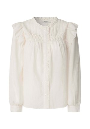 White blouse with a ruffled collar and shoulders, textured placket, long sleeves with elastic cuffs, and button closure at the front.