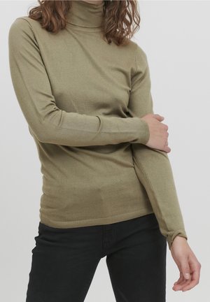 Pull à col roulé vert olive en tissu doux, avec un design ajusté et des poignets et un ourlet côtelés, parfait pour le superposition.