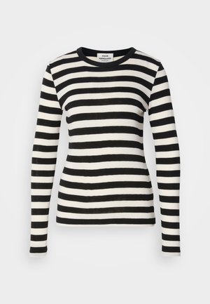 Striped long-sleeve shirt in black and white. Features a round neck and fitted design. Fabric appears soft with a smooth texture.