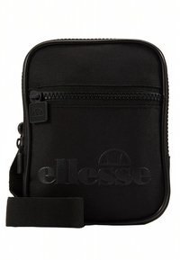 Geantă neagră din nylon, purtată încrucișat, cu suprafață texturată, închidere cu fermoar, logo embosat în față și curea reglabilă. Design compact, de formă dreptunghiulară.