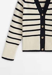 Striped cardigan in cream and navy blue, featuring a V-neck, ribbed cuffs, and five gold-tone buttons down the front.