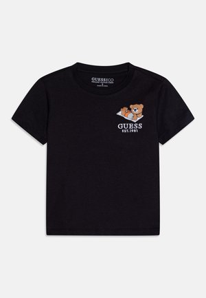 Zwarte katoenen T-shirt met een cartoonbeer graphic en borduurwerk "GUESS EST. 1981" op de borst. Korte mouwen en een ronde hals.