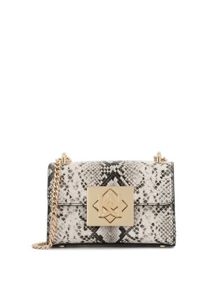 Black and white snakeskin pattern handbag with a gold geometric clasp and chain strap. Smooth texture with structured shape, flap closure.