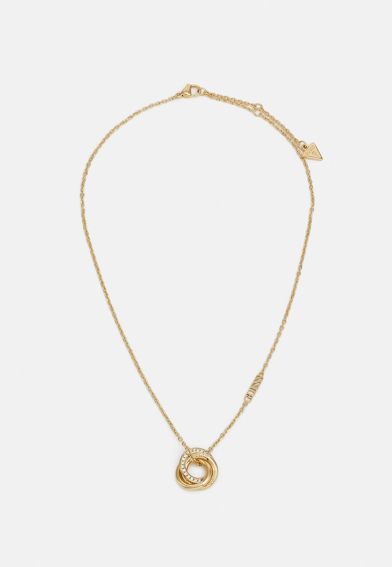 Gouden ketting met een gespiraliseerde cirkelvormige hanger, waarvan er één versierd is met kleine heldere edelstenen en een gegraveerd detail op de sluiting.