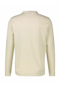 Langarmshirt in hellem Creme, aus weichem Stoff gefertigt. Verfügt über einen einfachen runden Ausschnitt und einen schlichten Rücken ohne sichtbare Nähte oder Muster.