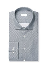 Chemise habillée à manches longues pliée avec un petit motif géométrique noir et blanc, des boutons blancs et un col classique sur fond blanc.