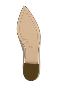 Semelle de chaussure à talon haut beige avec une forme pointue, finition lisse, logo discret et grip en caoutchouc texturé au talon.