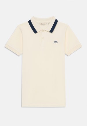 Polo en crème avec un col marine, manches courtes et patte de boutonnage à trois boutons. Présente un petit logo sur le côté gauche de la poitrine. Matériau en coton.
