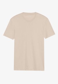 Beige cotton T-shirt with short sleeves, a round neckline, and a soft texture. No visible logos or patterns. Simple, minimalist design.