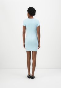 Light blue, short-sleeved dress with a fitted design and smooth texture. It features a round neckline and a seamless back.