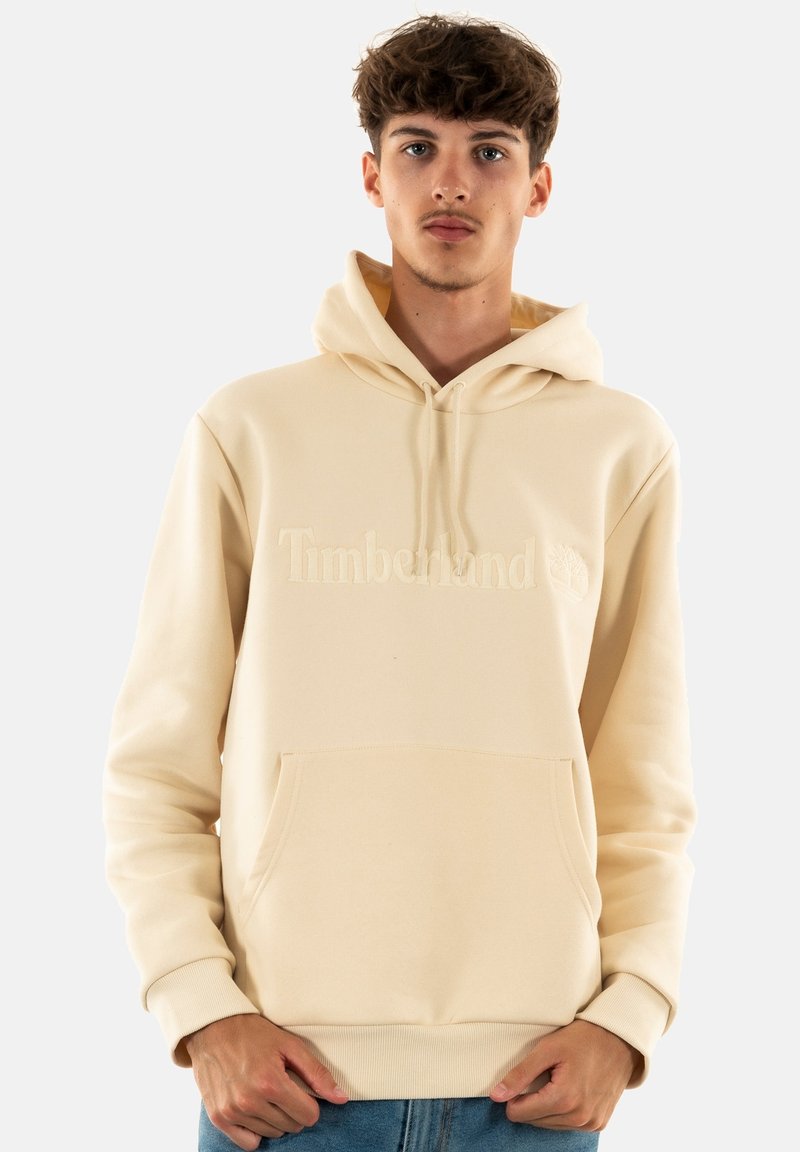 Felpa color crema con tasca a marsupio, polsini a coste e logo del brand ricamato. Texture liscia, design casual.