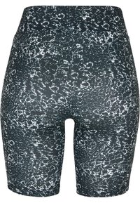 Shorts de vélo noirs et blancs à motifs, taille haute, en tissu extensible, avec une texture lisse et une coupe ajustée.