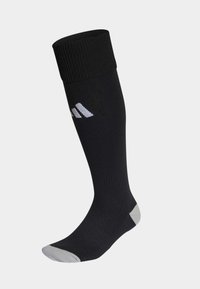Calcetín negro hasta la rodilla con puño acanalado, que presenta un logo blanco y acentos en gris claro en los dedos y el talón. Fabricado con un material suave y elástico.