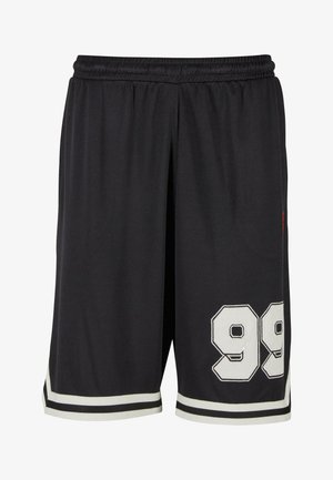 Sorte sportsbukser i stof med mesh-struktur, med hvid kant og stort broderet nummer "99" på venstre ben.