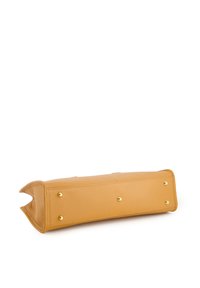 Leather handbag in mustard yellow, rectangular shape with a textured finish. Features gold studs on the base and a smooth top edge.
