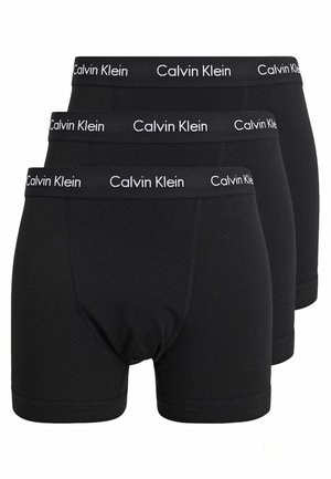 Zwarte boxershorts in een verpakking van drie. Gemaakt van zacht materiaal, met een logo in de tailleband. Rekbare pasvorm en een lengte tot halverwege de dijen met platte naden.