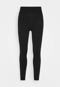 Schwarze Leggings aus dehnbarem Stoff mit hohem Bund. Glatte Textur mit minimaler Nahtführung und dezentem Logo in der Nähe des Knöchels.