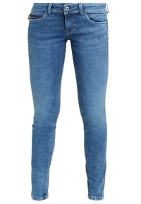 Jeans skinny in denim blu con effetto sbiadito, dotati di una tasca con zip, design a cinque tasche e dettagli di cuciture a contrasto.