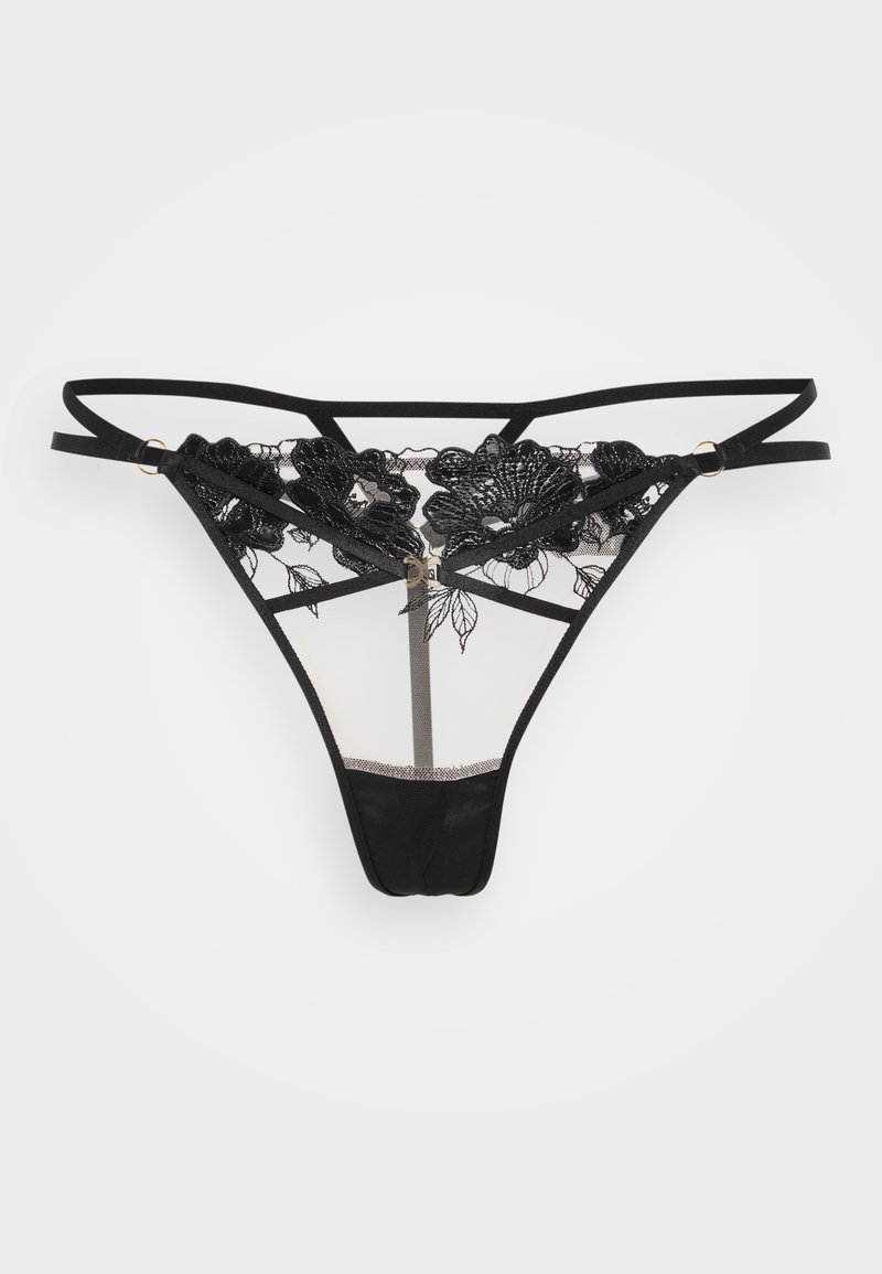 Tangas de renda preta com bordado floral, painéis de malha transparente, alças ajustáveis e acessórios em tom dourado. Tecido macio com cobertura mínima.