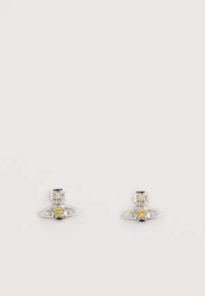 Silver stud earrings featuring a clear cubic zirconia at the top and a yellow cubic zirconia accent, set in a circular design.