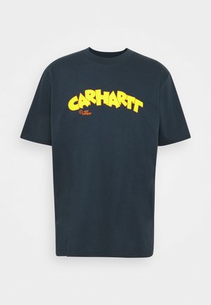 Blå bomulds t-shirt med en markant gul "CARHARTT"-logo i grafisk stil, med rund halsudskæring og korte ærmer.