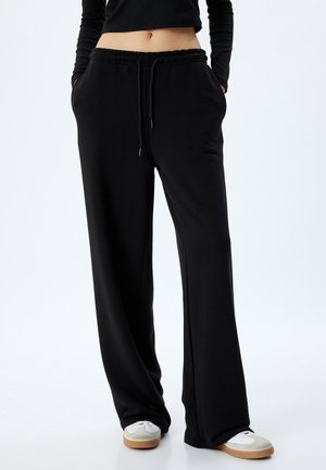 Pantalones deportivos - black