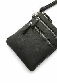 Black leather crossbody bag with textured surface, featuring two zipper compartments and silver hardware accents. Adjustable strap included.