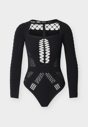 Μαύρο κορμάκι με μακριά μανίκια που διαθέτει μοτίβα από διάτρητο δίχτυ, μονόχρωμο μπροστινό μέρος και ανοιχτή πλάτη. Λείο ύφασμα με δομημένες λεπτομέρειες.