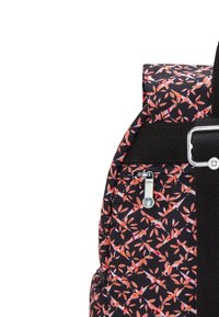 Black backpack featuring a floral pattern in shades of orange and pink, with a textured finish, zipper, and metallic hardware accents.