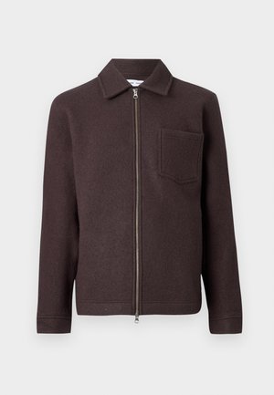 Brown wool jacket with a zip front, point collar, and single chest pocket. Smooth texture and fitted silhouette with long sleeves.