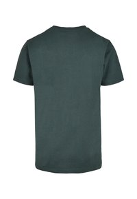Mörkgrön bomull t-shirt, kort ärm, rundad hals, enkel design, med rak fåll och mjuk textur, sedd bakifrån.
