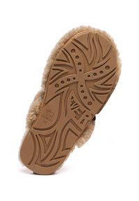 Tan fur slipper sole made of rubber, featuring a textured pattern with swirling lines and dots. Label reads "EVERAU" with size 38.