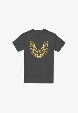 Gray cotton t-shirt featuring a large, yellow graphic of stylized wings and a head in the center, on a smooth fabric surface.