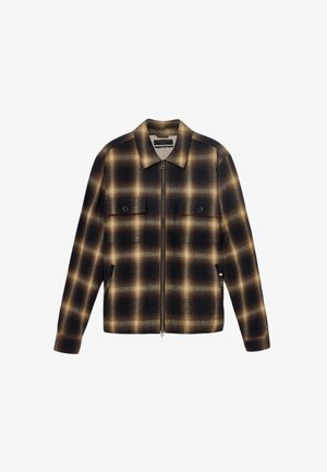 Mustaa ja ruskeaa ruudullista vetoketjullista takkia, jossa on kaulus, kaksi etutaskua ja sileä kangas. Takissa on napitaskujen koristeena.