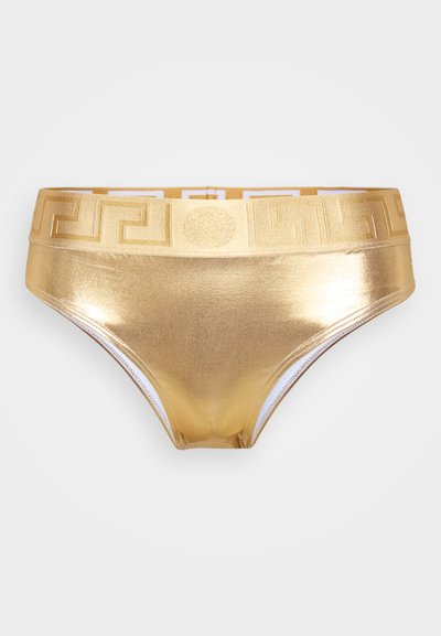Zelta metāla bikini apakšdaļa ar gludu tekstūru, kurai ir rakstainas elastīgas jostas stīgas zeltainos un baltos toņos.