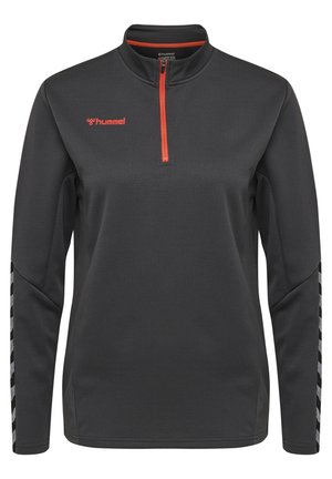 Zwarte quarter-zip pullover met rode rits en logo, met lange mouwen en gestileerde accenten aan de zijkanten. Geweven stofafwerking.