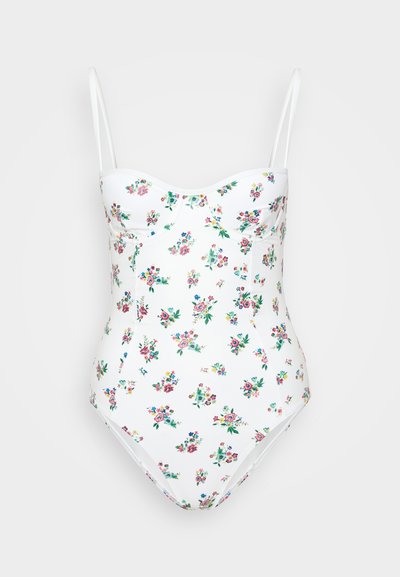 Costume da bagno floreale bianco con spalline regolabili, caratterizzato da un corpetto sagomato, scollo a cuore e stampa floreale multicolore su tutta la superficie.