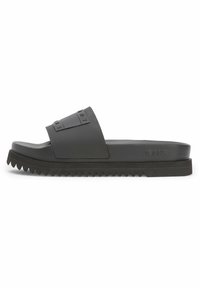 Black slide sandals with a wide strap featuring embossed lettering. Textured sole with zigzag pattern, material appears rubber-like and durable.