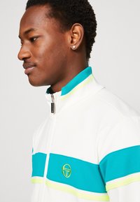 Sergio Tacchini DAMARINDO TRACKSUIT SET - Trainingspak - vanilla ice/blue grass