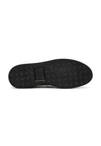 Black rubber shoe sole with a textured pattern featuring crosses. Includes a rectangular indentation for branding or design detail.