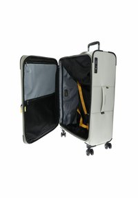 Grijze harde koffer met een ritssluiting, twee compartimenten, interne riemen en soepele wielen. Voorzien van een cijferslot.