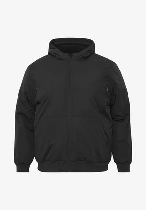 Veste à capuche noire en tissu lisse et léger. Elle dispose d'une fermeture éclair à l'avant et de poignets élastiques. Comprend deux poches latérales zippées.