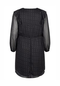 Svart knälång klänning med genomskinliga långa ärmar, vertikala prickiga guldstrimmor, volangdetaljer på axlarna och elastisk midja, visad bakifrån.