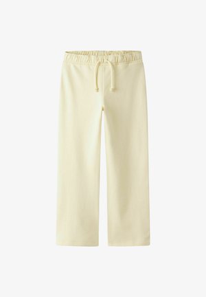 Pantalone širokih nogavica boje kreme s elastičnim pojasom i vezicom, izrađene od glatkog tkanja, prikazane ravno na bijeloj pozadini.