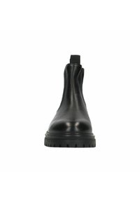 Bottine en cuir noir à hauteur de cheville avec des panneaux élastiques sur les côtés, un bout arrondi et une semelle en caoutchouc épaisse présentant un motif texturé pour une meilleure adhérence.